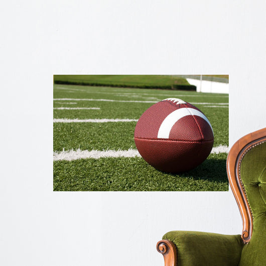 Closeup of American Football on Field Wall Mural