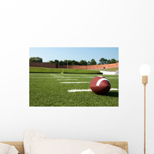 Closeup of American Football on Field Wall Mural