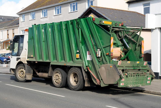 Green Rubbish Truck with Boxes in the Back Wall Mural