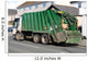 Green Rubbish Truck with Boxes in the Back Wall Mural