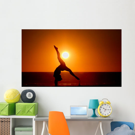 sunset silhouette gymnast on beach Wall Mural
