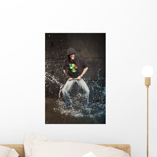 Hip-hop dancer in aqua studio showin his tongue Wall Mural
