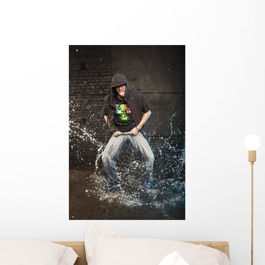 Hip-hop dancer in aqua studio showin his tongue Wall Mural
