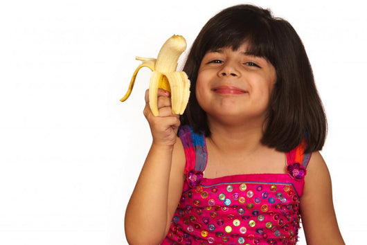Young Girl Eating Banana Wall Decal
