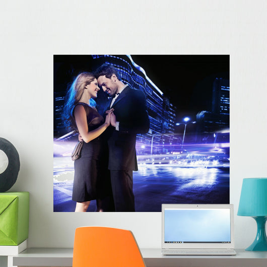 Handsome young couple dancing on the street and smiling Wall Mural
