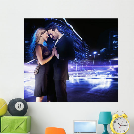 Handsome young couple dancing on the street and smiling Wall Mural