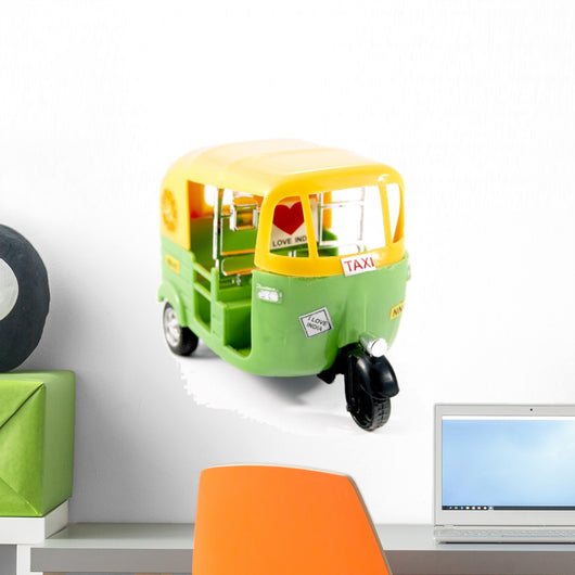 Plastic tuk-tuk from India, with sticker