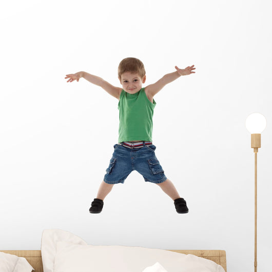 happy little boy with hands in air Wall Decal