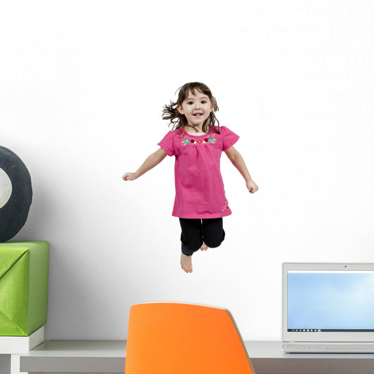 Adorable little girl jumping in air. isolated on white backgrou Wall Decal