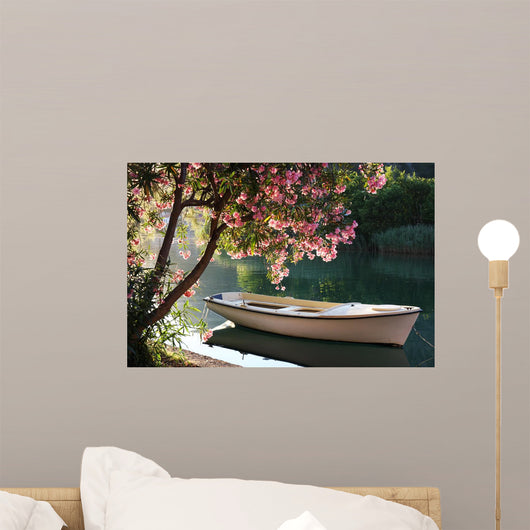Boat on a River Under a Blooming Tree Wall Decal