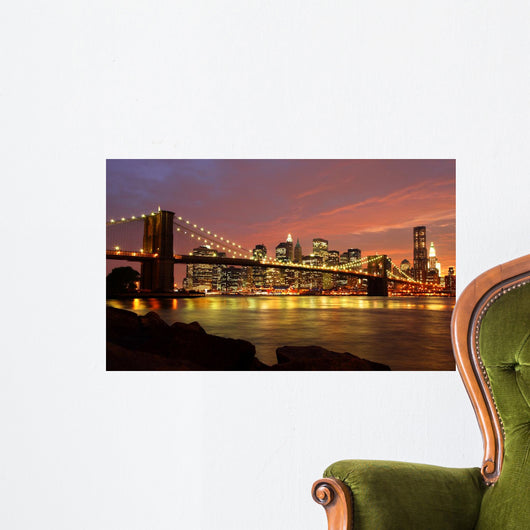 Brooklyn Bridge with city skyline at night Wall Mural