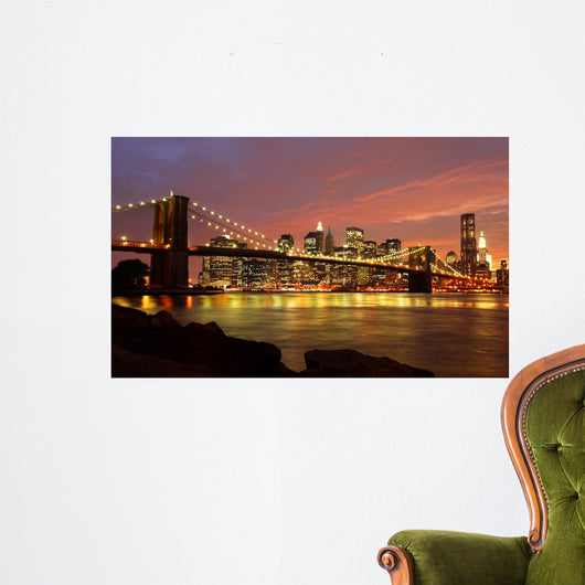 Brooklyn Bridge with city skyline at night Wall Mural