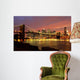 Brooklyn Bridge with city skyline at night Wall Mural
