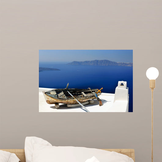 Old boat with oars on the bright white roof Wall Mural