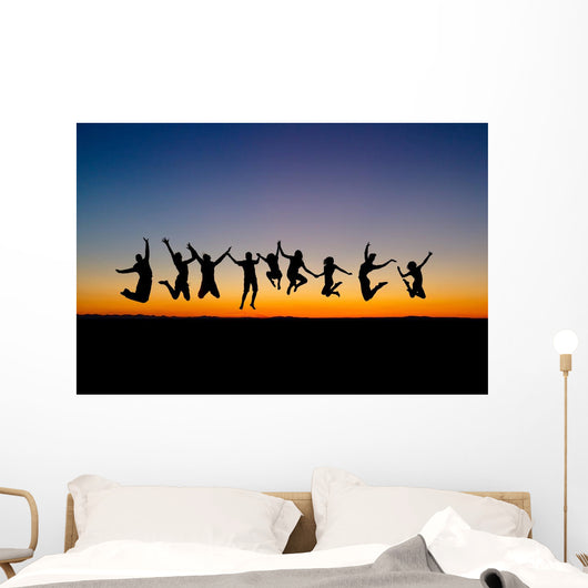 Silhouette Friends Jumping Sunset