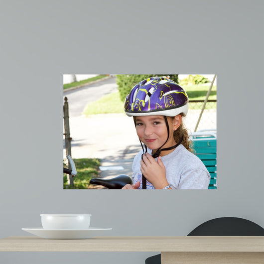 Cute Girl in a Helmet Is Going for a Ride Wall Mural