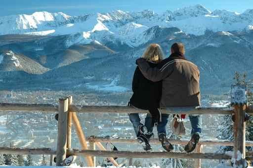 Couple Sitting on Fence at Tatra Mountains Wall Decal