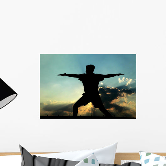 Silhouette of Man Practicing Yoga Wall Mural