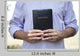 Man Holding Black Bible