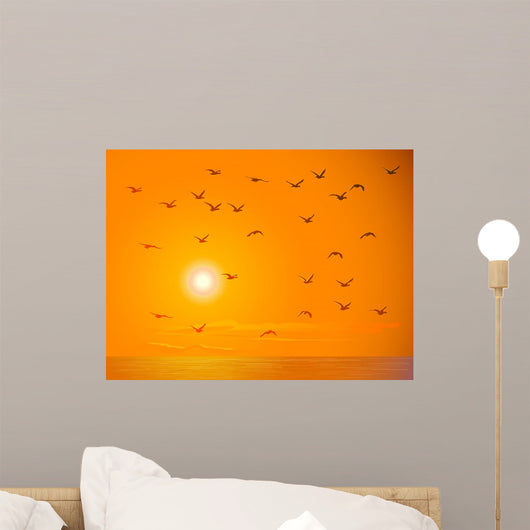 Flying Birds Against Orange Sunset Wall Mural