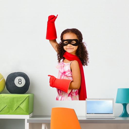 Portrait of pretty mixed race girl playing super hero Wall Decal