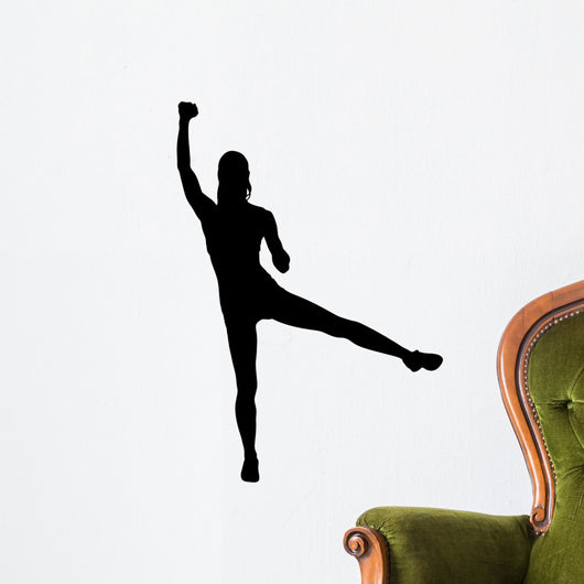 A silhouette of an attractive woman lifting weights Wall Decal