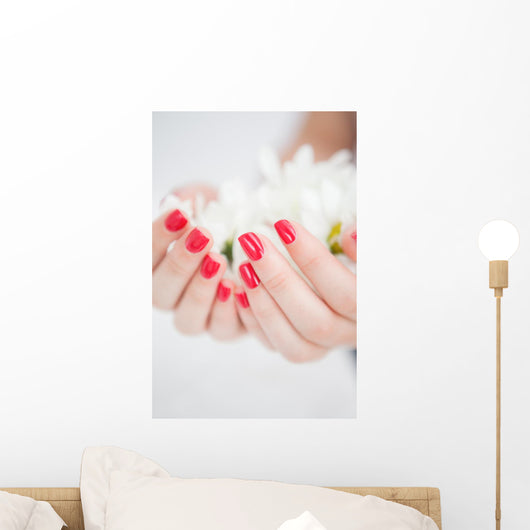 Manicured Hands Holding Flowers