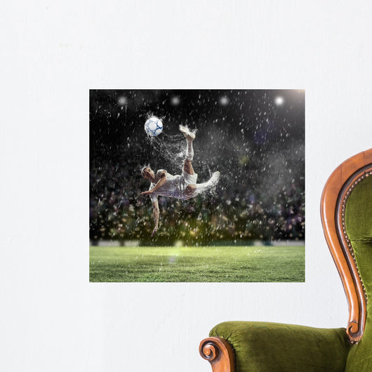 Football Player Striking Ball