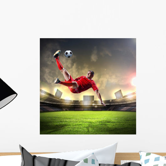 Football Player Striking Ball
