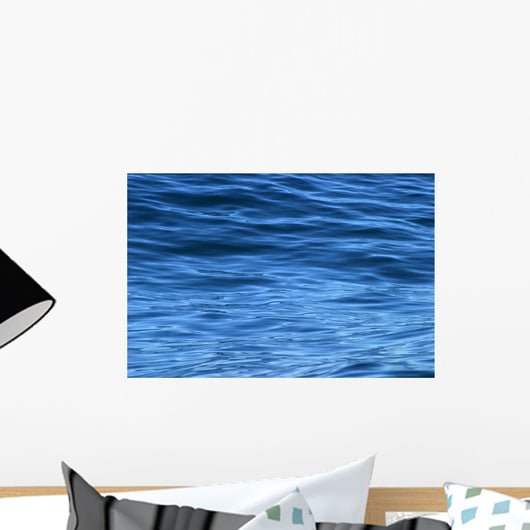 beautiful calm ripples on deep blue ocean on a bright sunny day Wall Mural