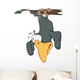 Raven hanging up feet on a branch Wall Decal