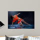 Woman dancing under rain in orange dress. Studio Wall Mural