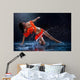 Woman dancing under rain in orange dress. Studio Wall Mural