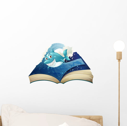 A Book with a Smiling Blue Shark and Waves Wall Decal