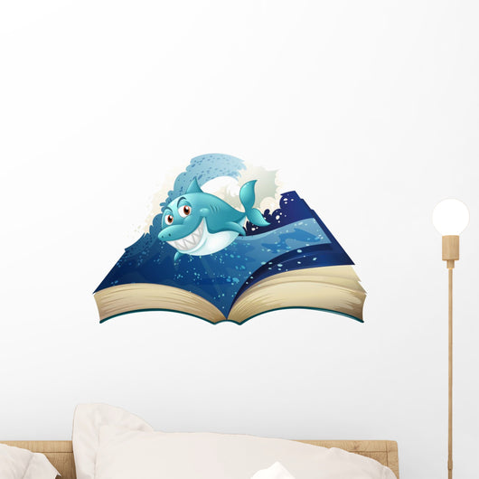 A Book with a Smiling Blue Shark and Waves Wall Decal