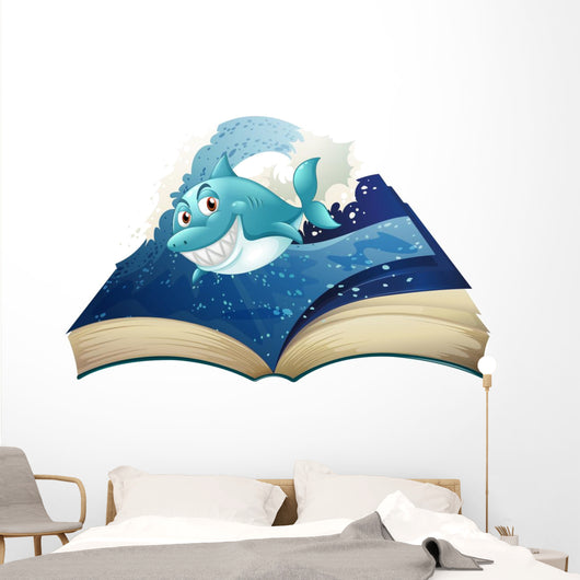 A Book with a Smiling Blue Shark and Waves Wall Decal