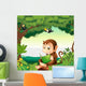 A monkey reading a book at the forest Wall Decal