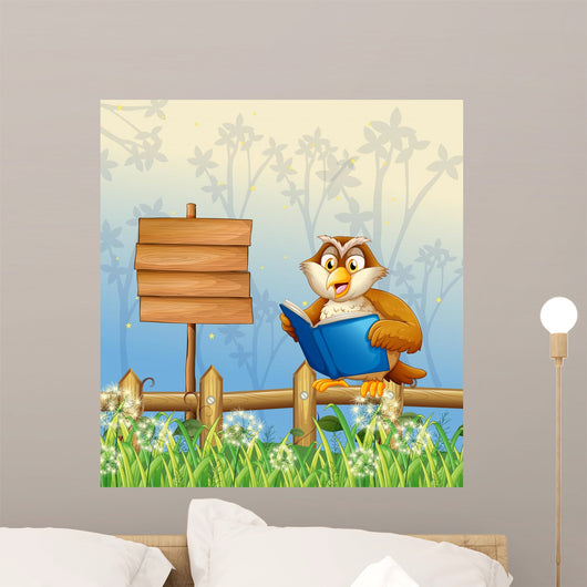 An owl reading a book beside a wooden signboard Wall Mural