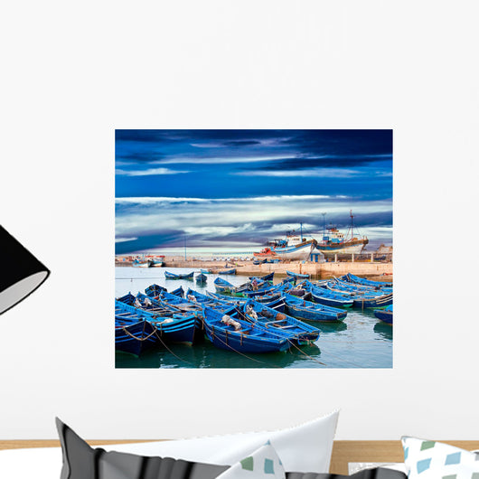 Blue fishing boats on an ocean coast in Essaouira, Morocco Wall Mural