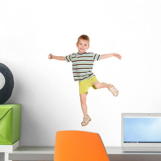 little boy in striped T-shirt dancing. Wall Decal