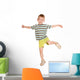 little boy in striped T-shirt dancing. Wall Decal