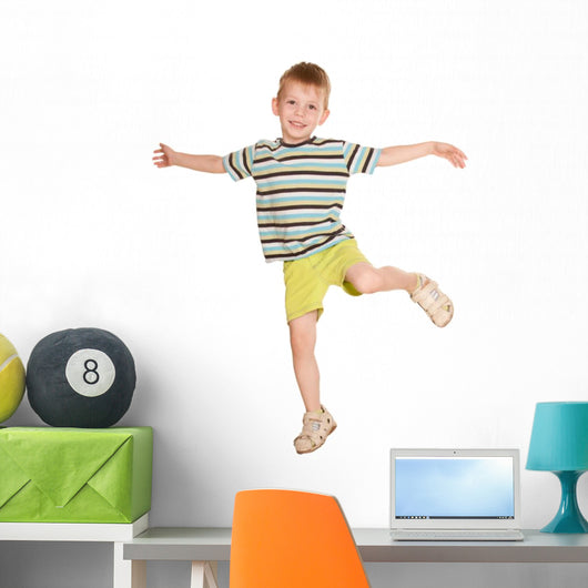 little boy in striped T-shirt dancing. Wall Decal