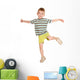 little boy in striped T-shirt dancing. Wall Decal