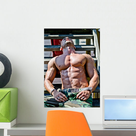 Muscular Bodybuilder Laying Wood