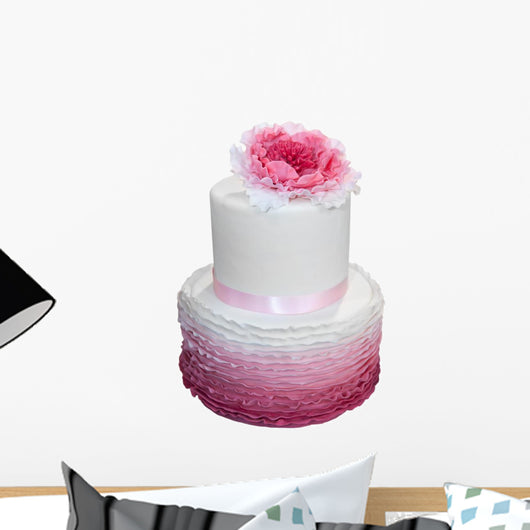 Beautiful wedding cake with pink flower isolated on white