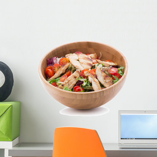 Grilled chicken salad in wooden bowl isolated on white Wall Decal