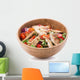 Grilled chicken salad in wooden bowl isolated on white Wall Decal