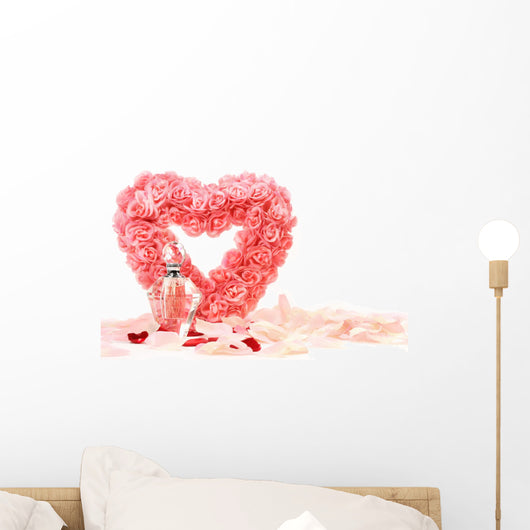 Heart of roses with perfume bottle on white background Wall Mural