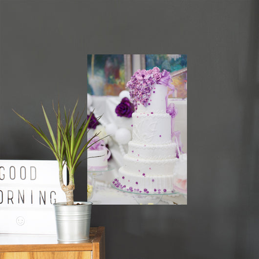 White Wedding Cake Decorated With Purple Flowers