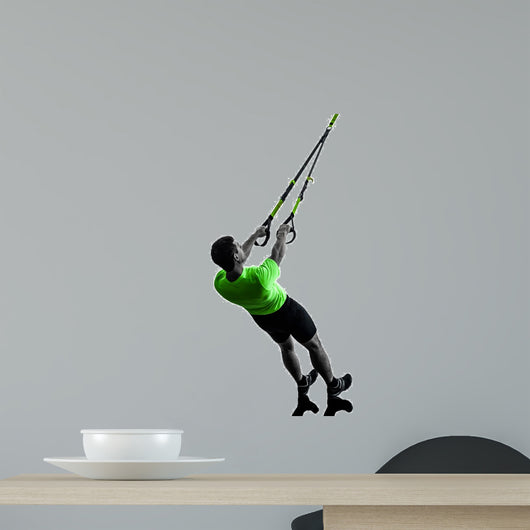 man exercising suspension training trx silhouette
